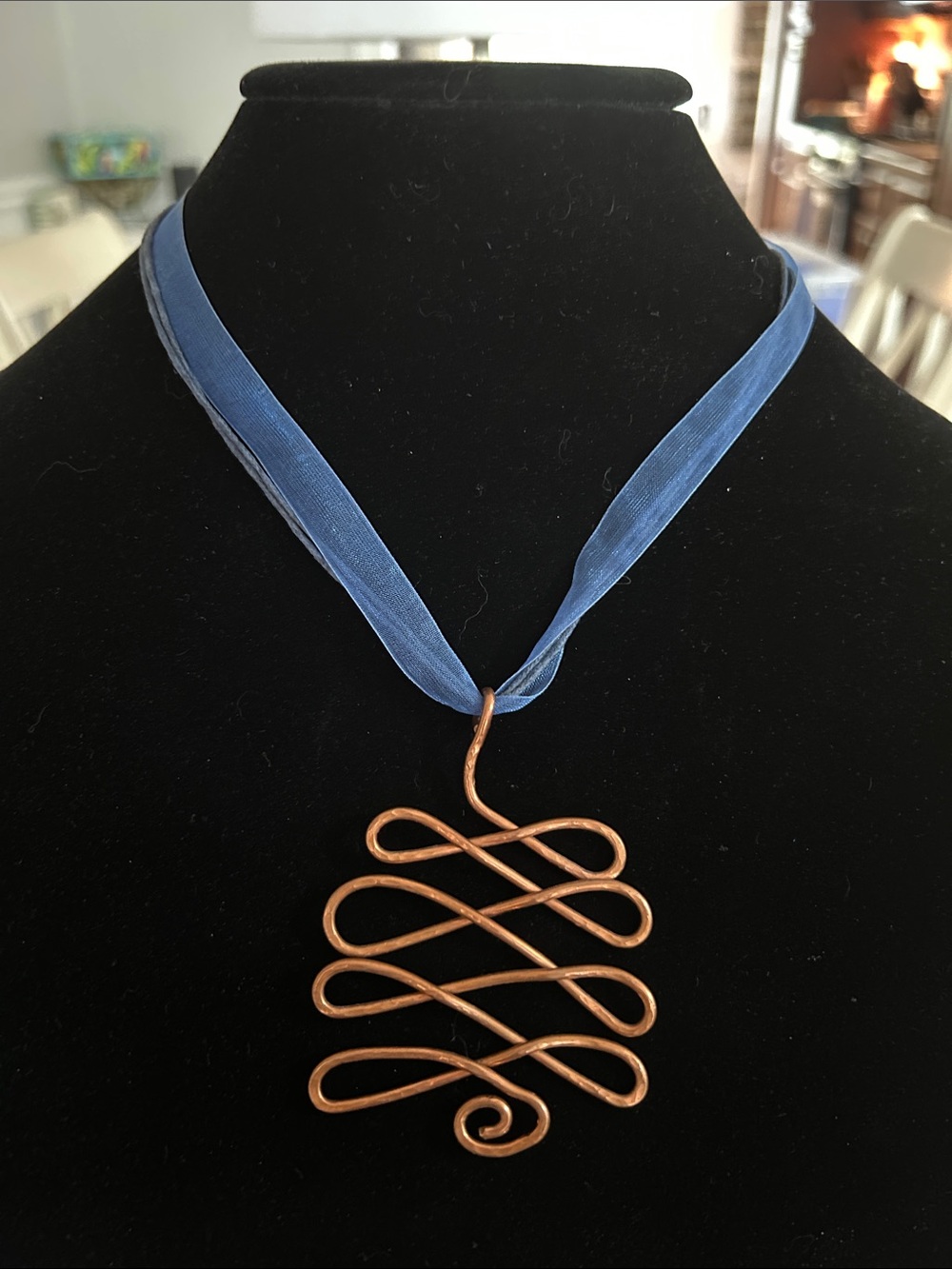 Copper Swirl Pendant Necklace on Blue Ribbon